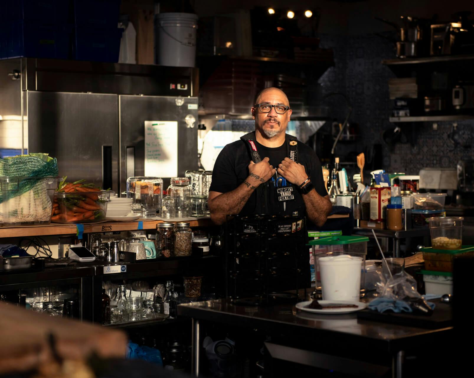 Chef Russell Jacskon standing in the kitchen of his Restaurant called Reverence in NYC