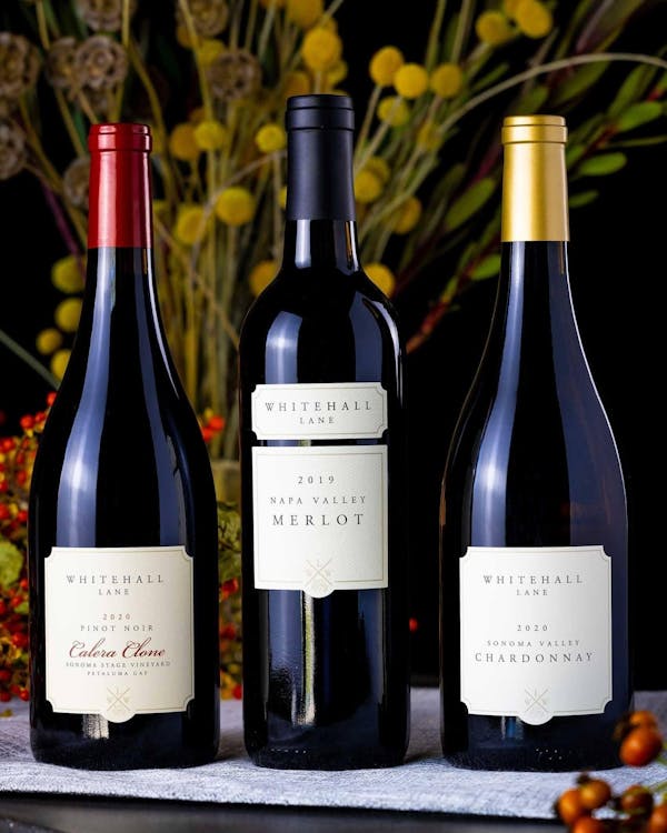 A variety of bottles from Whitehall Lane winery including a Chardonnay, Merlot, and Pinot Noir.