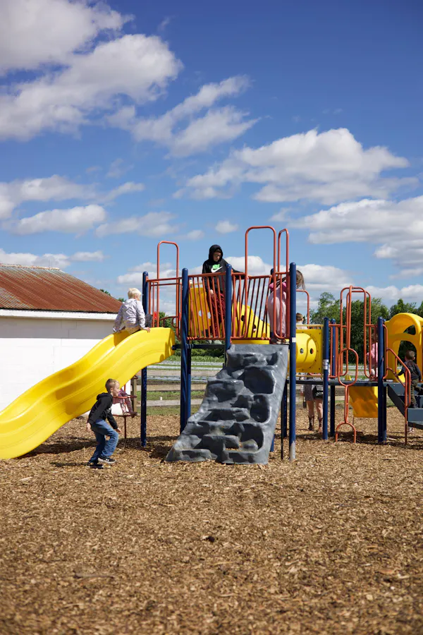 playground slide, outdoor play equipment, recreation, public space, chute, child