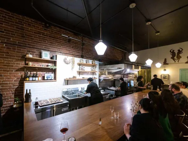 ceiling, light fixture, countertop, restaurant, customer, kitchen