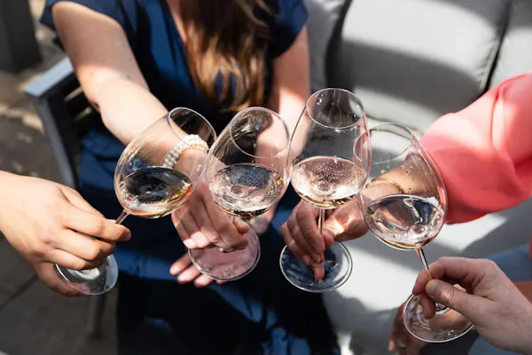 hand, tableware, stemware, drinkware, alcoholic beverage, eyewear