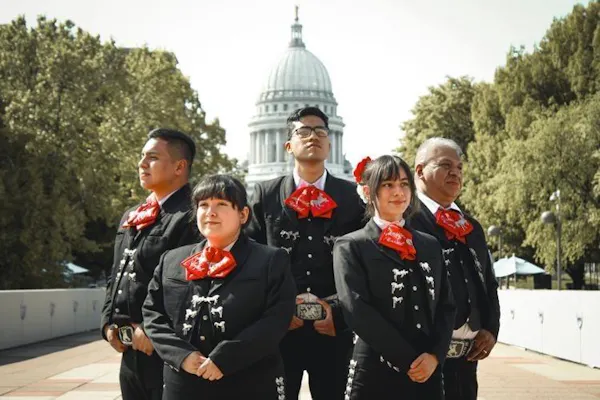 outerwear, smile, uniform, coat, necktie, tradition
