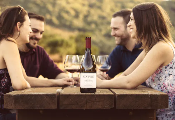 table, bottle, arm, photograph, furniture, smile
