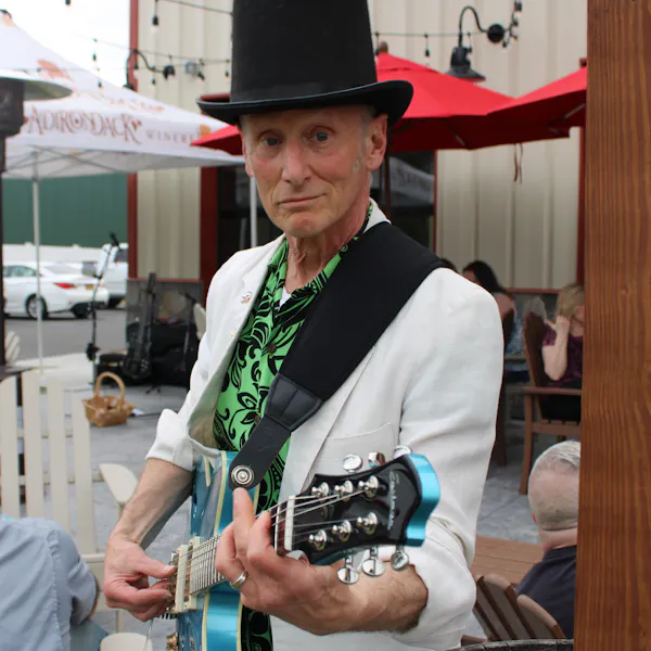 clothing, musical instrument, string instrument, hat, chordophone, plucked string instrument
