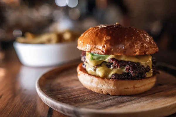 food, hamburger, tableware, ingredient, bun, bread