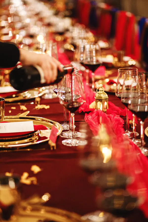 red, tableware, stemware, cutlery, drinkware, tablecloth