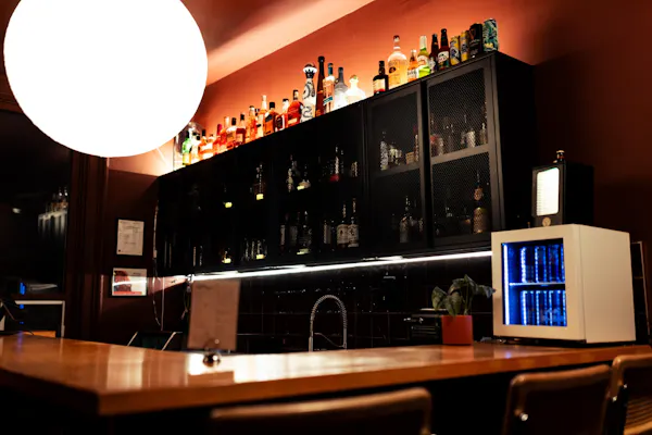bottle, furniture, alcoholic drink, drinkware, lighting, liquor