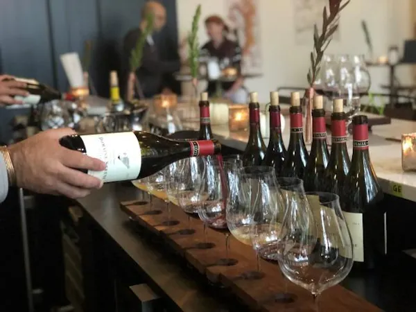 bottle, tableware, drinkware, table, drinking establishment, stemware