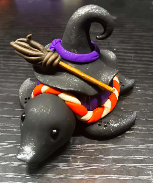 toy, animal figure, figurine, fictional character, plastic, witch hat