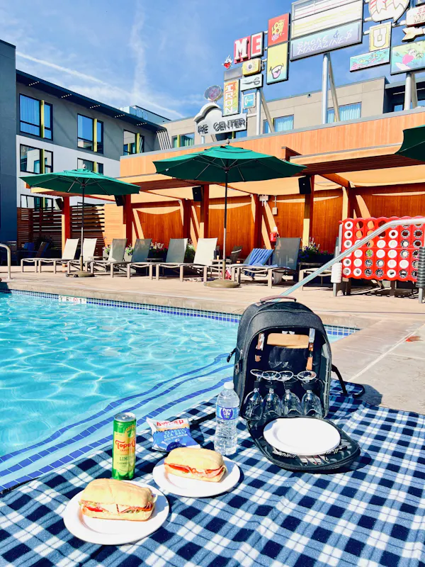 swimming pool, outdoor furniture, leisure, umbrella, resort, sunlounger