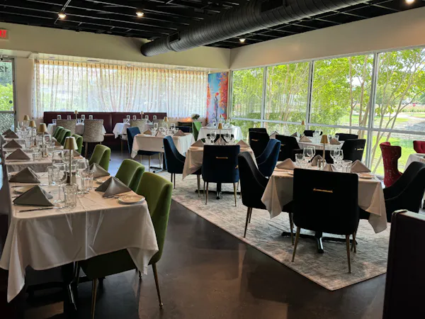furniture, chair, tablecloth, table, restaurant, drinkware