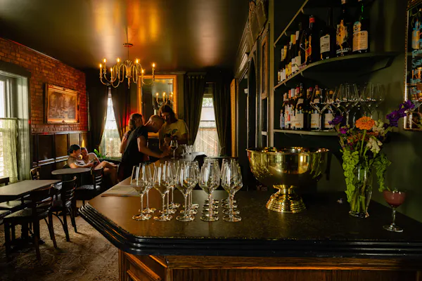 picture frame, drinking establishment, drinkware, bottle, barware, table