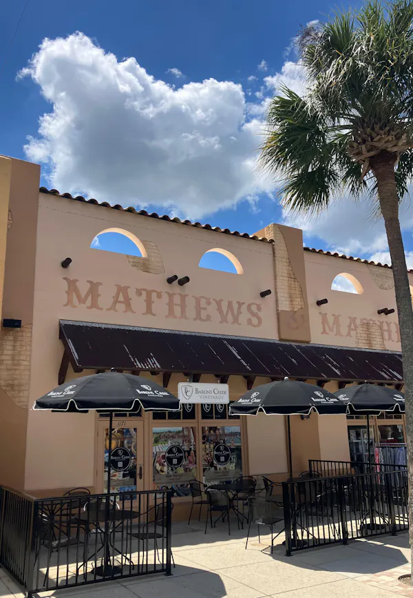 commercial building, awning, logo, shade, palm trees, restaurant