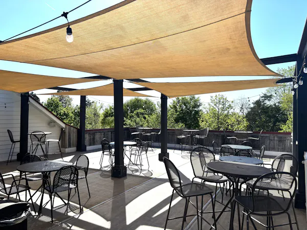 furniture, outdoor furniture, shade, chair, outdoor table, restaurant
