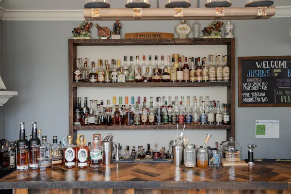 bottle, drinkware, barware, glass bottle, shelf, wine
