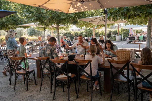 furniture, chair, table, outdoor furniture, restaurant, umbrella
