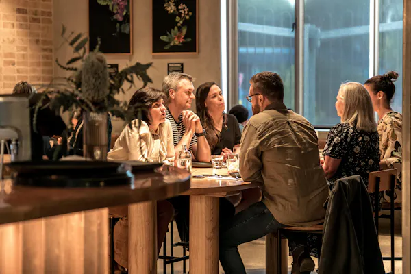 table, interaction, picture frame, houseplant, jacket, event