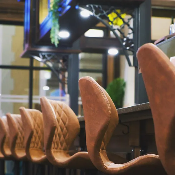 wood, hat, gesture, steering wheel, automotive mirror, chair
