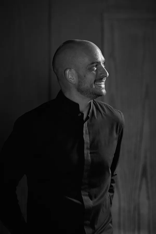 photograph, sleeve, monochrome photography, collar, standing, facial hair