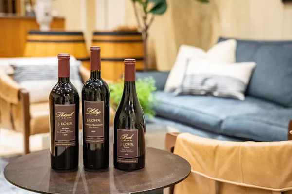 table, furniture, bottle, drinkware, wine, glass bottle