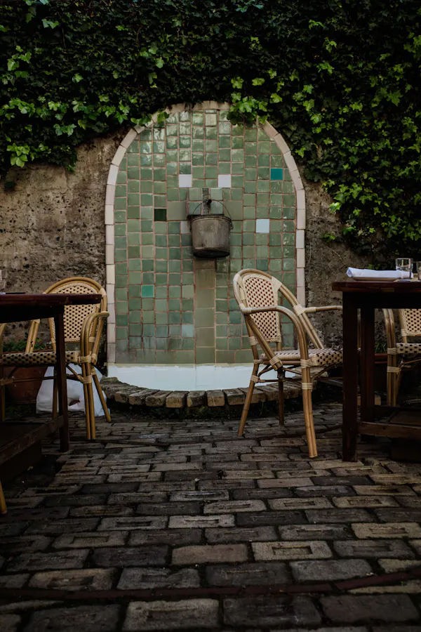 outdoor table, outdoor furniture, chair, flagstone, stone wall