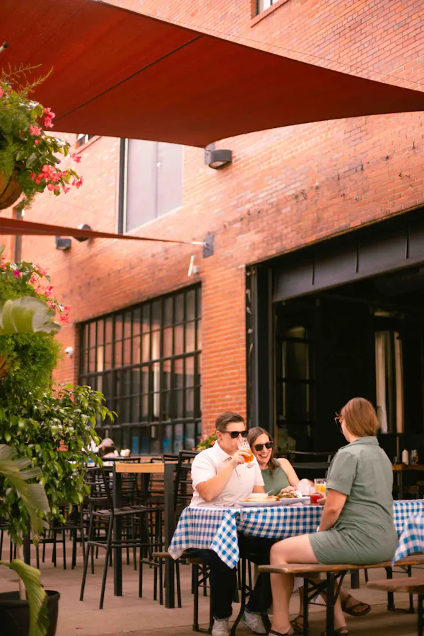 furniture, outdoor table, restaurant, outdoor furniture, chair, umbrella