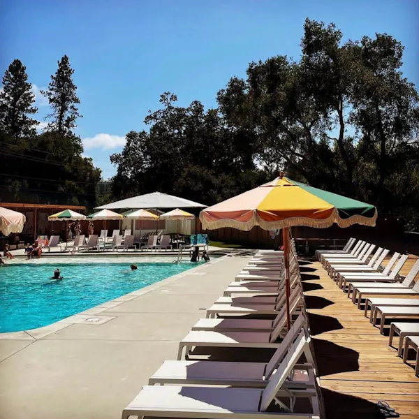 swimming pool, outdoor furniture, umbrella, leisure, resort, furniture
