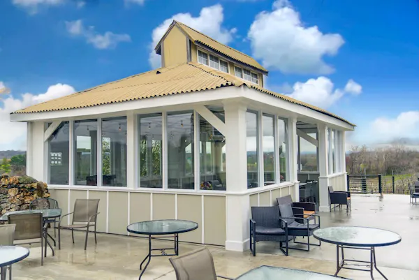 chair, porch, shade, balcony, outdoor structure, glass
