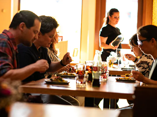 tableware, hand, furniture, shirt, table, drinkware