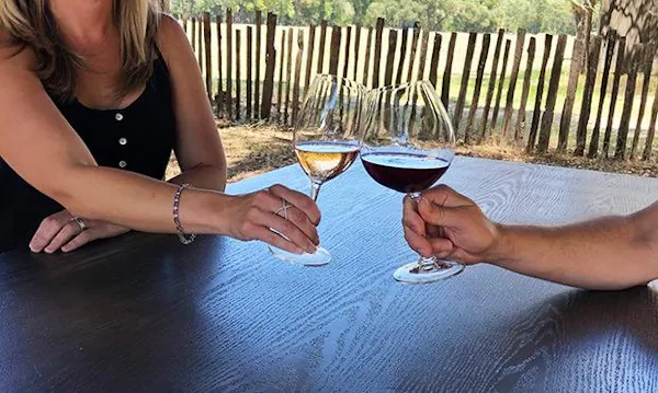 tableware, hand, stemware, drinkware, wine glass, sunglasses