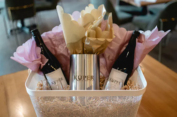 bottle, alcoholic drink, glass bottle, barware, basket, packaging and labeling