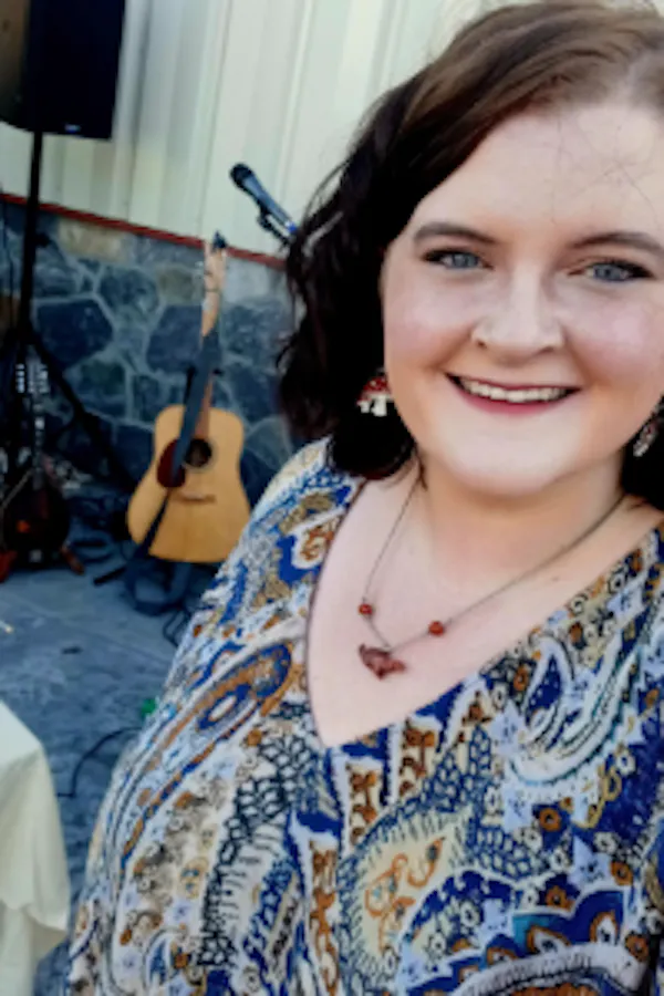 smile, hairstyle, chordophone, jewellery, guitar, plucked string instrument