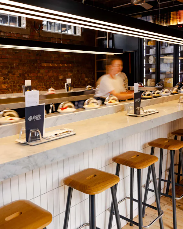 countertop, restaurant, kitchen, bar, light fixture, shelf