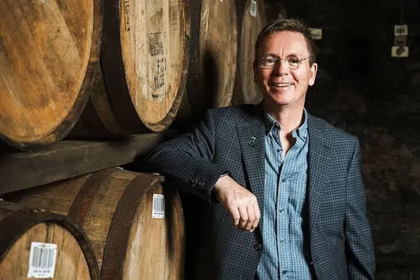 smile, barrel, winery, dress shirt, blazer, wine cellar