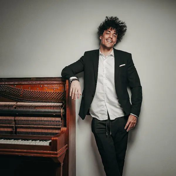 smile, facial expression, collar, formal wear, musical instrument, blazer