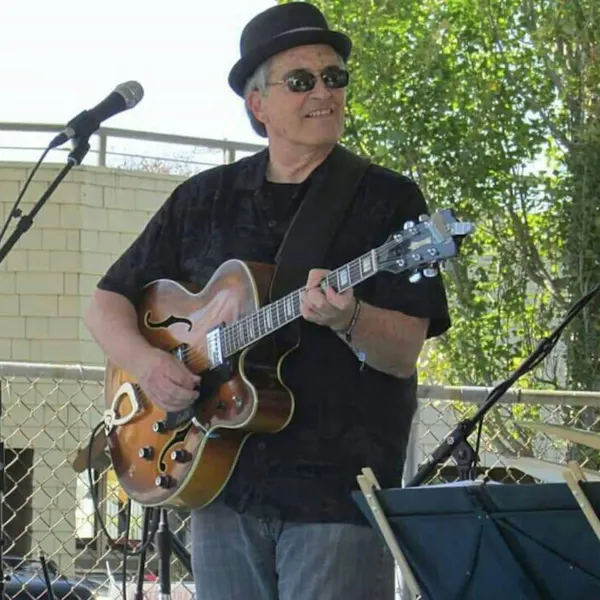 musical instrument, string instrument, plucked string instrument, chordophone, eyewear, guitarist