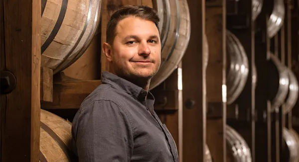 sleeve, smile, facial expression, barrel, winery, facial hair