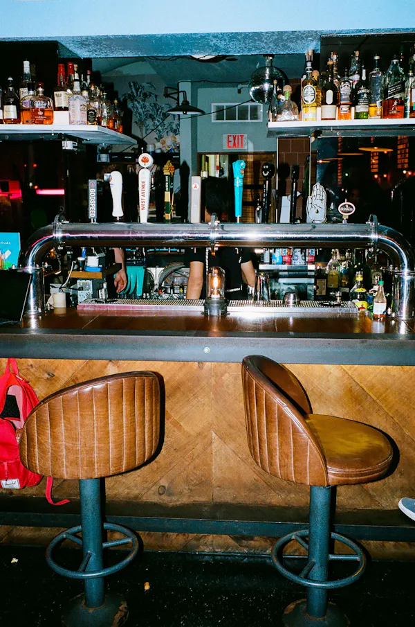 bar stool, bottle, bar, countertop, drinkware, pub