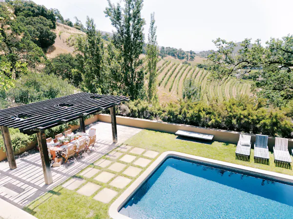 swimming pool, outdoor furniture, leisure, resort, garden, shade