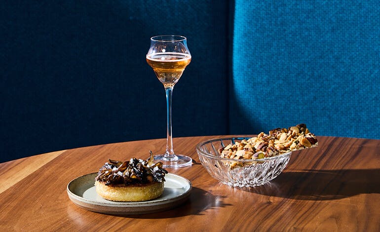 Corvino - plated desserts and apterivos on a wooden table