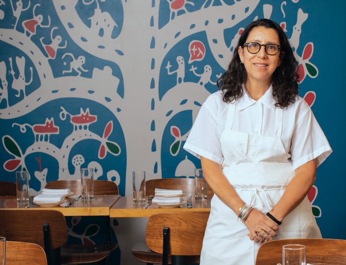 Chef portrait against a blue background
