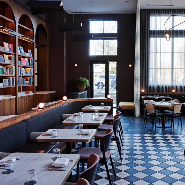 Lucian restaurant interior with blue and white tiled floor