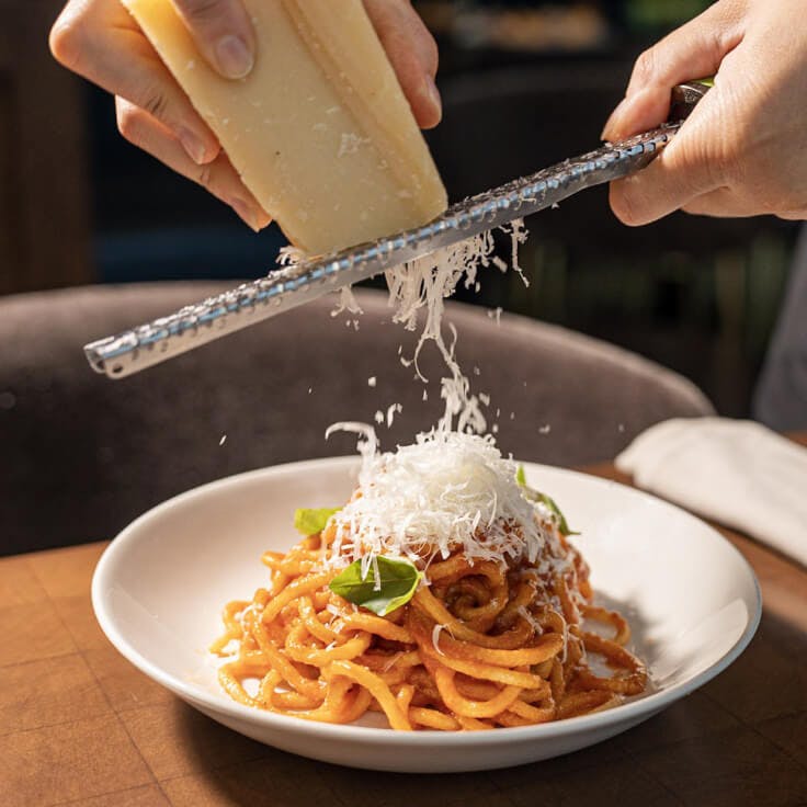 L'Ardente - beautifully plated dish with spagetti and cheese grated on top