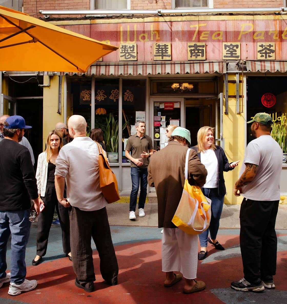 People conversing outdoors for a Resy and American Express event