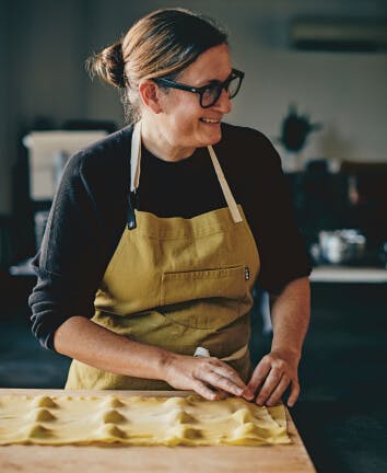 Chef preparing dish in kitchen