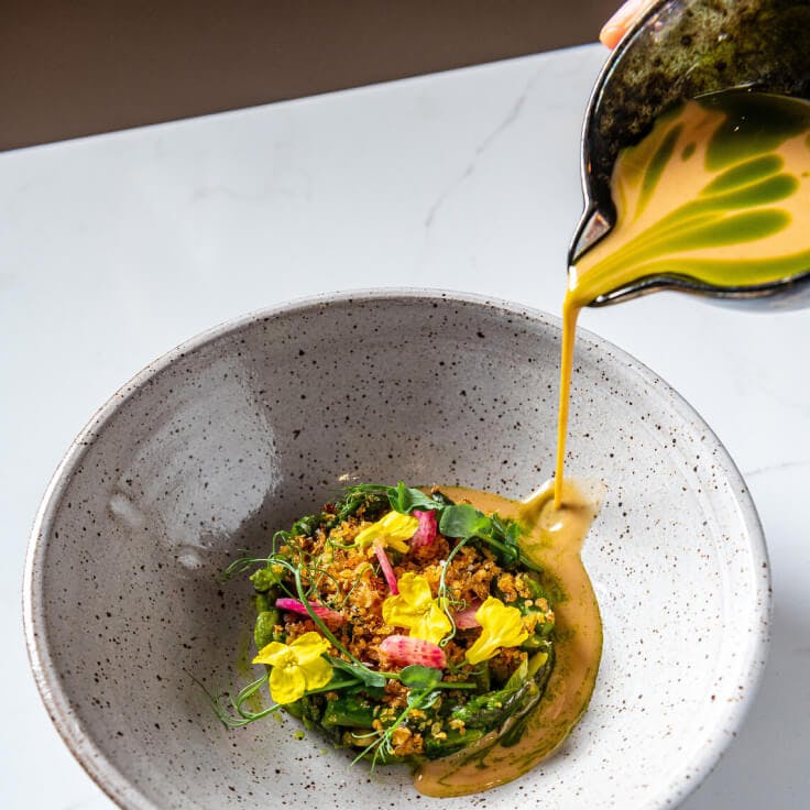 Oyster Oyster plated dish with sauce being poured on top