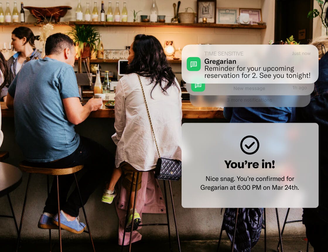 People dining at a bar with a notification UI overlay