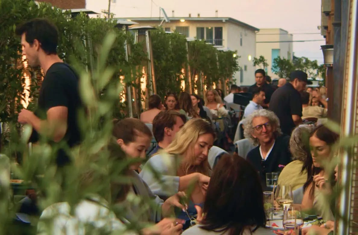 Market Venice - Los Angeles, CA - busy restaurant exterior with outdoor seating as the sun is setting