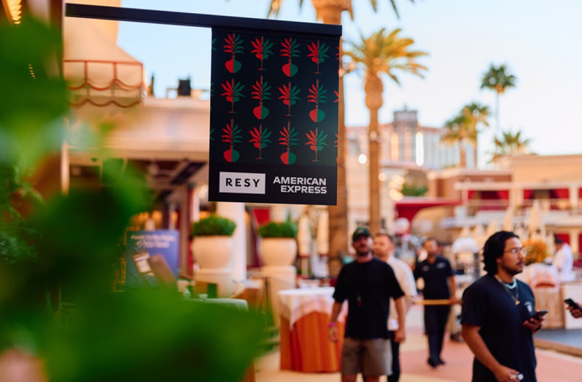 Community and industry event with people interacting and Resy and American Express branding